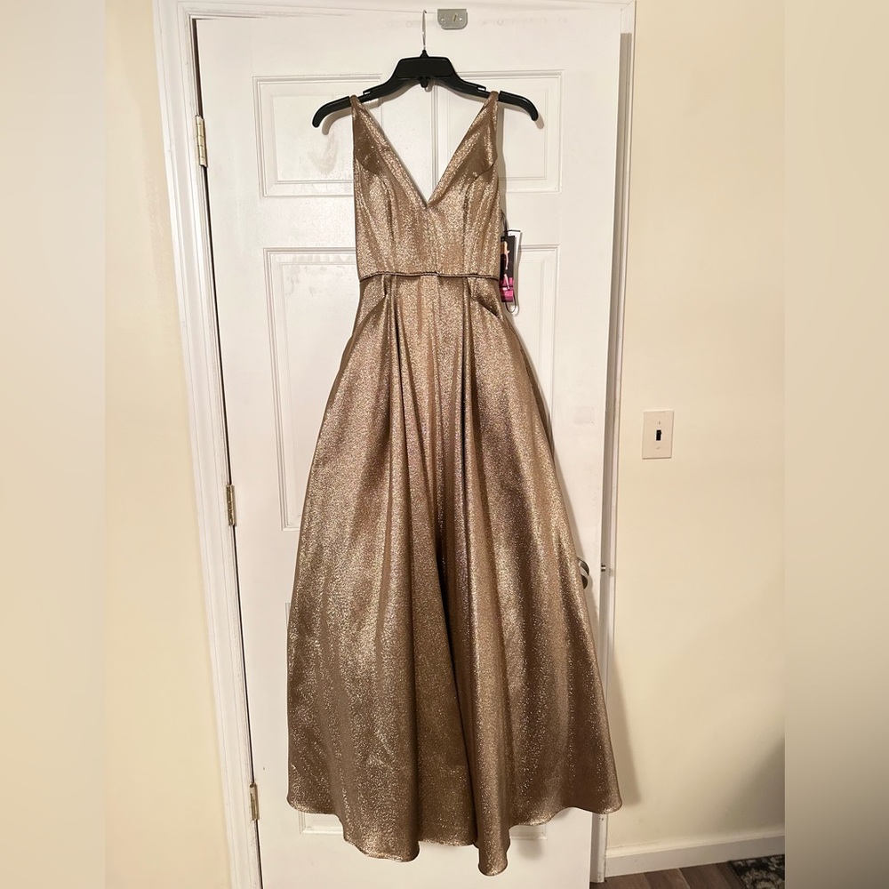 Camille La Vie Brand New Double V Metallic A-Line Ballgown
Size 0, Color Bronze